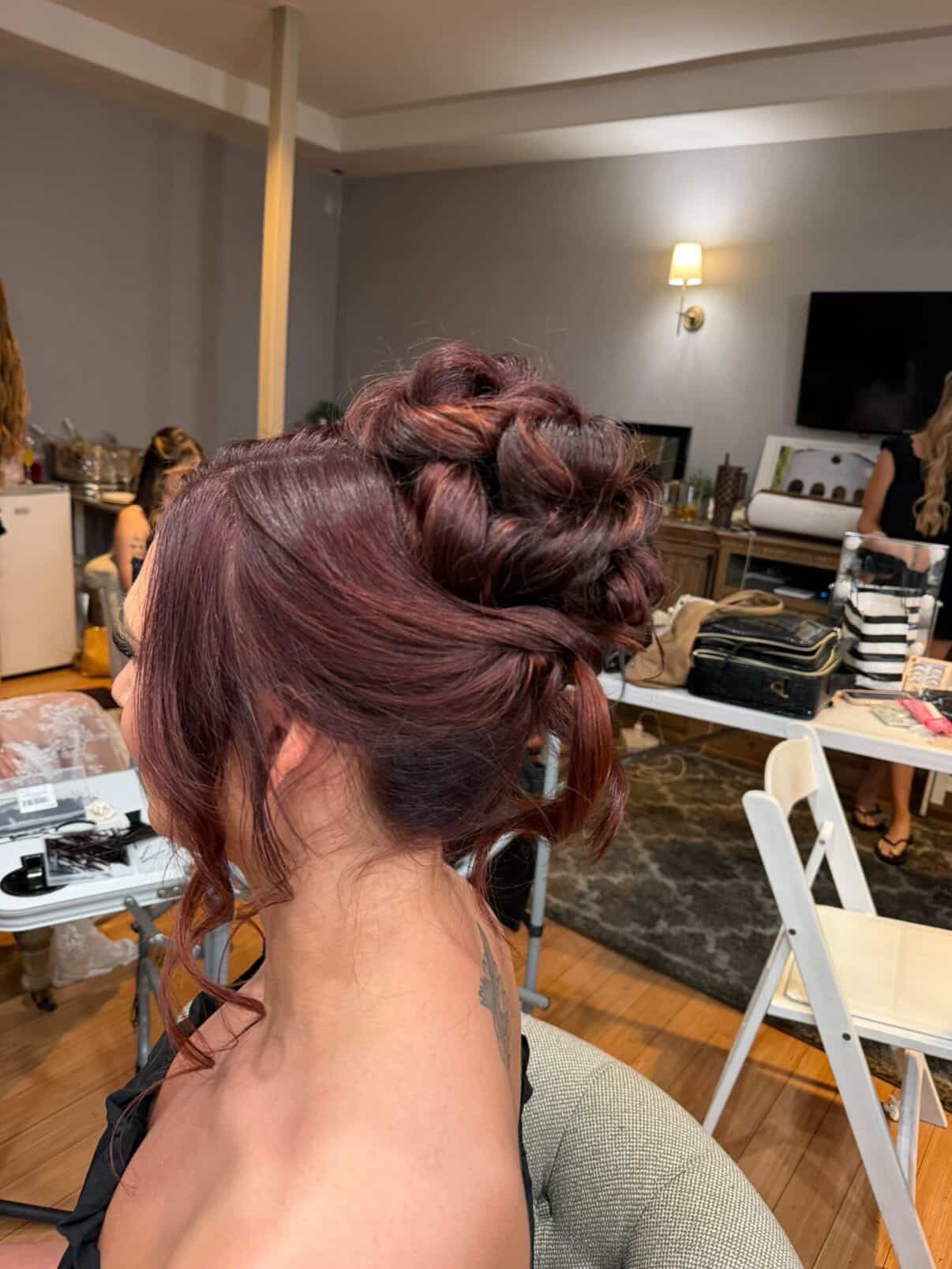 Elegant bridal updo with soft, polished details in Dana Point